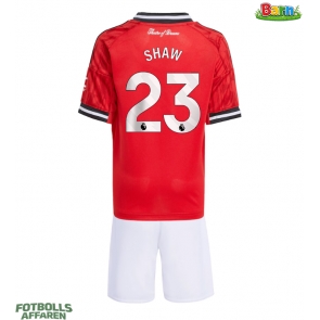 Manchester United Luke Shaw #23 Hemmaställ Barn 2025-26 Kortärmad (+ Korta byxor)